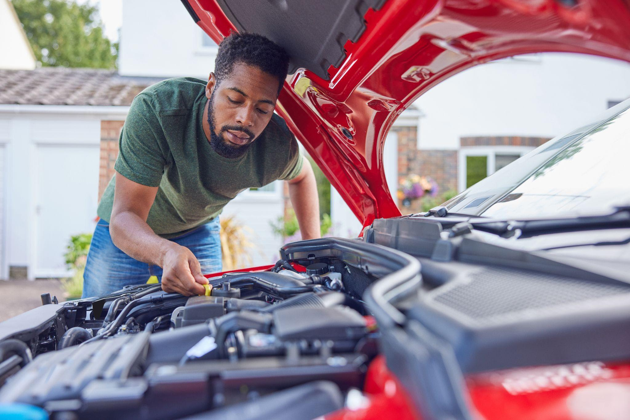 Human check. Car engine Wash. Car Oil change. Man under Hood. Men checking car.